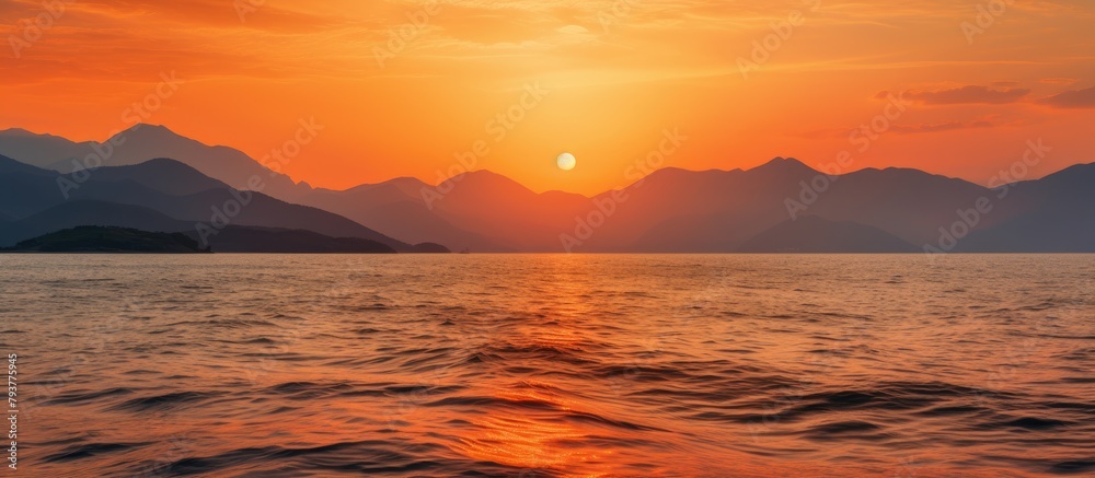 Sticker Sunset ocean mountains backdrop