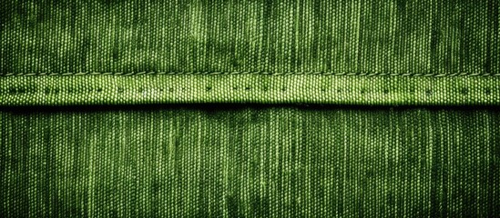 Naklejka premium Close-up of textured green fabric with stitch pattern