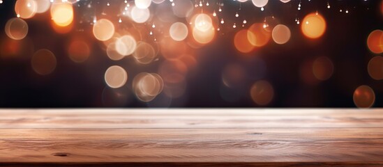 Wooden table top with blurred lights - obrazy, fototapety, plakaty