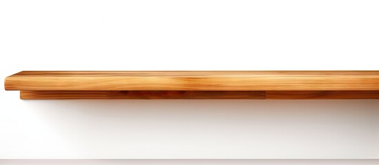 Wooden shelf on white wall casting a shadow