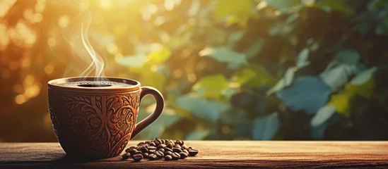 Foto op Canvas A steaming cup of coffee © Ilgun