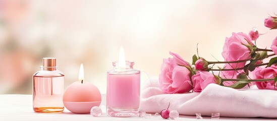 Obraz na płótnie Canvas Perfume bottles, towel, pink roses on table