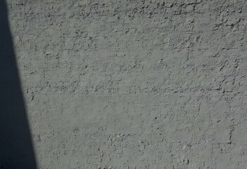 wall. grey, with the shadow of a window, realistic. Generative AI.	