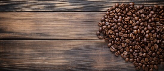 Heart-shaped coffee beans on wooden surface