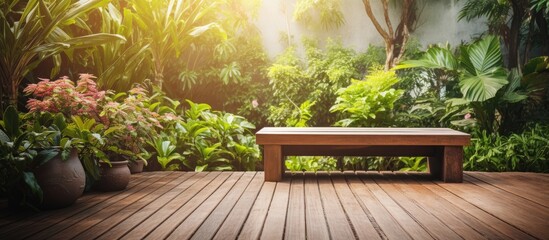 Wooden bench on deck by lush forest