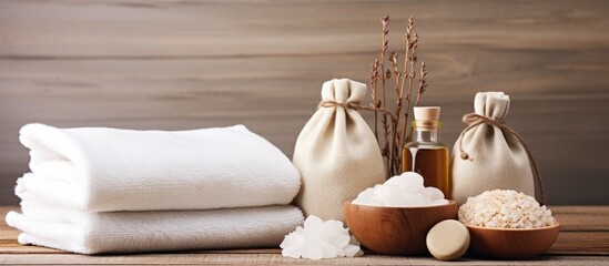 Towels, Soap, and Salt on Wooden Table