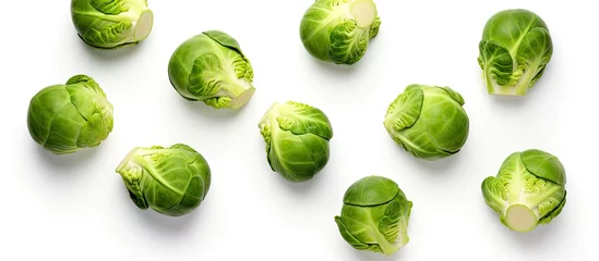 Poster Group of fresh brussels sprouts on a white surface © Ilgun