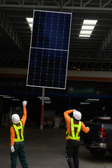 Worker installs solar panels. Worker installs solar panels at a solar farm field...