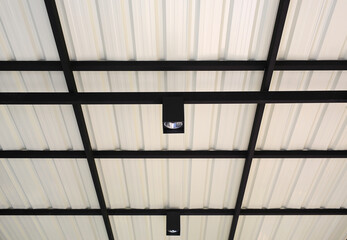 Bulb hanging from the roof of metal sheet structure. - 793792911