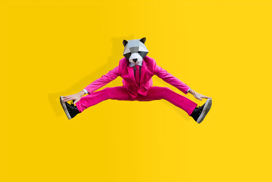 Man with funny low poly mask on colored background