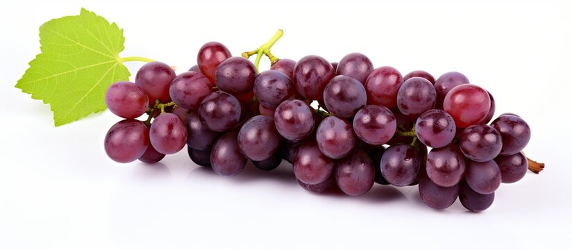 Bunch of Grapes With Leaf on White Surface