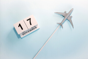 November calendar with number  17. Top view of a calendar with a flying passenger plane. Scheduler....
