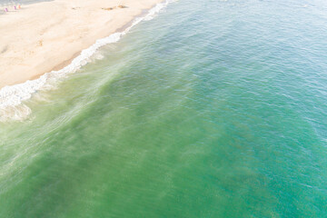 Empty turquoise water beach in the Algarve, Portugal. Aerial shot view with drone