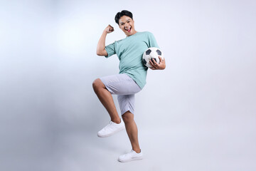 Full Length of Attractive Young Sports Man Clenching Fist Show Winning Gesture of Football Club Isolated on White Background