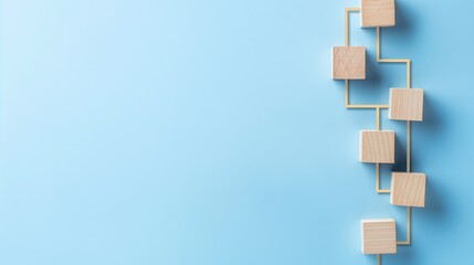 Automation of business processes and workflows using a flowchart made of wooden blocks set against a blue backdrop. systems for managing workflow and organizational structure.