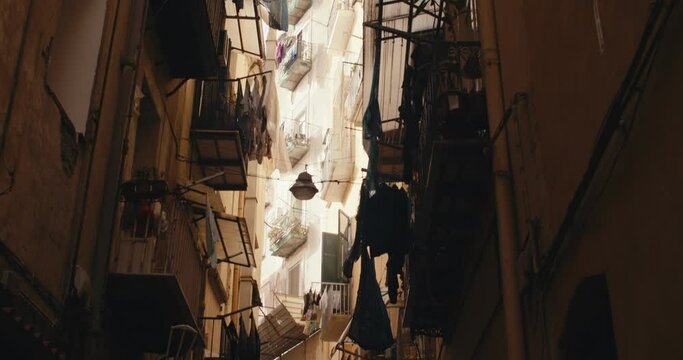 Narrow street Spanish quarter balcony Naples Italy handheld tilt up