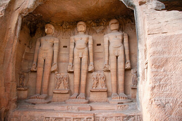 Jain sculptures carved along both the rock faces of the valley, popularly known as Rock - Cut Jain Images Urwai Gate or Siddhanchal group of caves, Fort complex, Gwalior, Madhya Pradesh, India