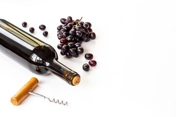 Obraz premium Bottle of wine with corkscrew and grapes. Wine background