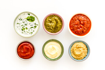 Bowls with various sauces for the meat or vegetables. Food background