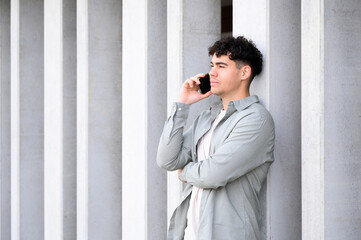 handsome young man talking on smartphone