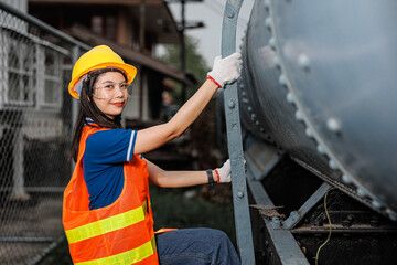 portrait Asian young teen engineer worker standing happy smile outdoor waring safety reflective with hardhat. - 793844177