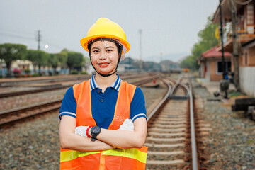 portrait train locomotive engineer women worker. Happy Asian young teen smiling work at train station train track locomotive service maintenance. - 793844332