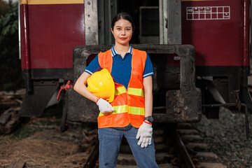 portrait Asian young teen engineer worker standing happy smile outdoor waring safety reflective with hardhat. - 793844362
