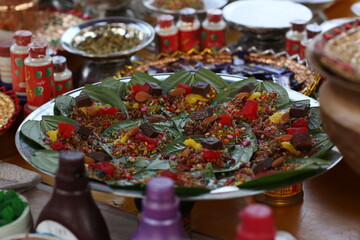This is All testy sweet cherry metha khatta pan Nirmal, Banarasi paan or betel leaf garnished with betel nut and all indian colorful Banaras ingredients for sale at pous fair,
