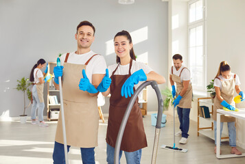 Male, female cleaner portrait, happy workers vacuuming, mopping, professional janitor service busy...