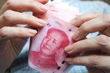 RMB recalculation close-up. Renminbi official currency of China. - 793851559