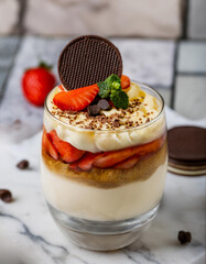 dessert with yogurt strawberry cheesecake trifle chocolate biscuit in glass