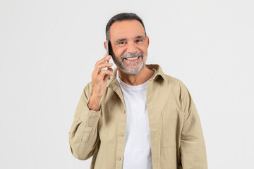 Man Talking on Cell Phone On White