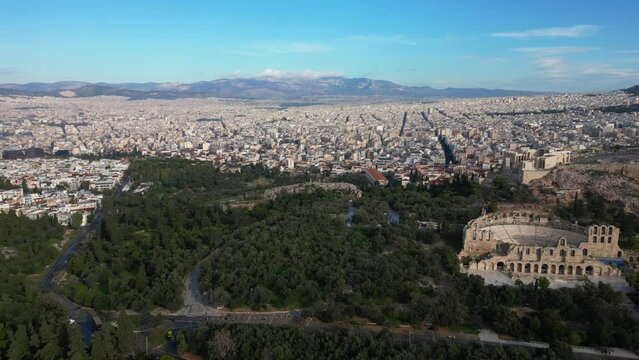 Drone aeial view of Athens city with Green nature Forest park in Acropolis in Greece, Parthenon in Athens drone aerial view, famous Greek tourist attraction