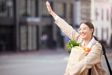 Woman, shopping and stop taxi with bag of groceries, food and vegetables for healthy diet in city. Smile, travel and person wave for cab transportation, sales and happy customer calling ride outdoor