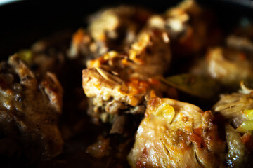 delicious homemade fried meat in a pan, closeup