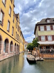 Urban medieval landscape of Alsace, water canal Colmar, France. 