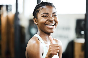 Exercise, thumbs up and portrait of black woman in gym for fitness, performance training or...