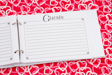 Retro old white and black guest book with red and white hearts