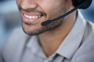 Call center, man and smile with headphones in office for customer service, consulting or telemarketing. Salesman, happy and technology with job for help desk, sales support and advisory at work