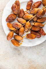 date branch dried sweet fruit fresh meal food snack on the table copy space food background rustic...