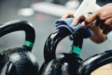 Gym, cleaning or hand with sanitizer for kettlebell, safety or prevention or germs, virus and...