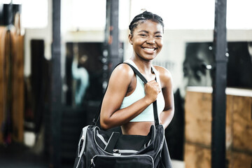 Bag, fitness and portrait with black woman athlete in gym, ready for training or workout. Exercise,...