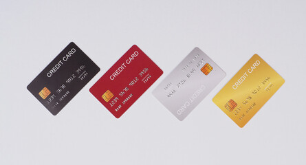 Four credit cards on white background.