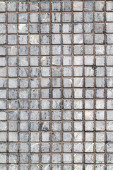 Small square tile on the wall. Abstract background