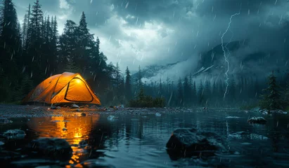 Fotobehang Glowing orange tent is pitched on lake shore as thunderstorm approaches © Vadim