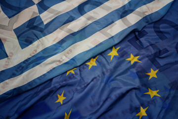 waving colorful flag of european union and national flag of greece.finance concept.