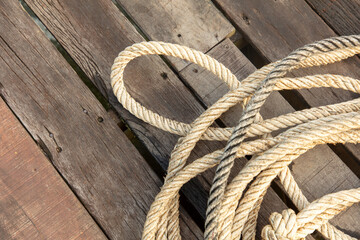 Rope on a wooden background - 793902983