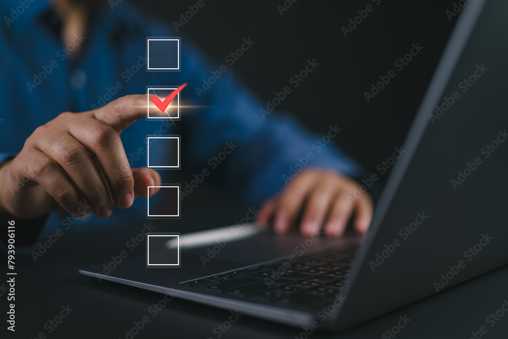 Aufkleber Checklist concept. Businessman using laptop tick correct mark in checkbox on virtual screen.