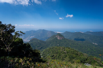 Incredible view of the wonderful city of Rio de Janeiro. Pico da Tijuca offers tourists and adventurers a beautiful panoramic view of the Tijuca forest, mountains, beaches and the city's buildings.
