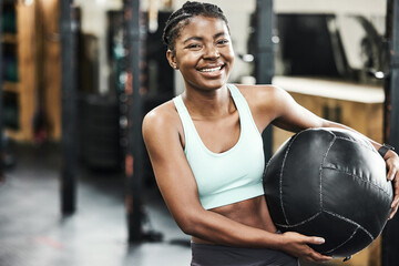 Fitness, medicine ball and portrait of black woman in gym for strength training or workout....